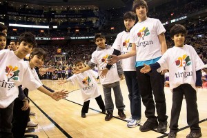 As part of the festivities, Iranian children wearing Tirgan shirts had the privilege of walking on the basketball court during halftime.
