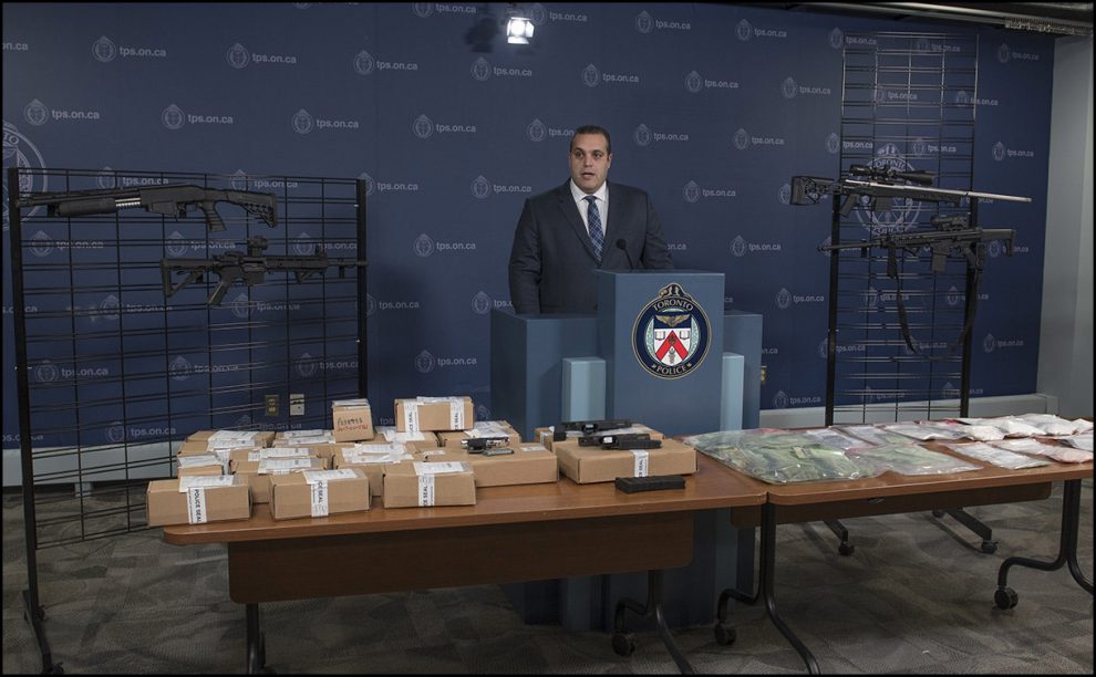 Inspector Peter Moreira speaks to the media about the seizure of guns, cash and drugs.